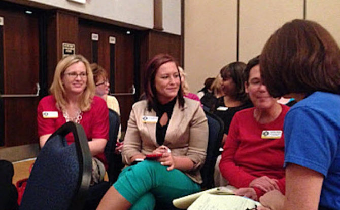Group of woman sitting and chatting during an activity led by Keynote Speaker Vicki Hitzges