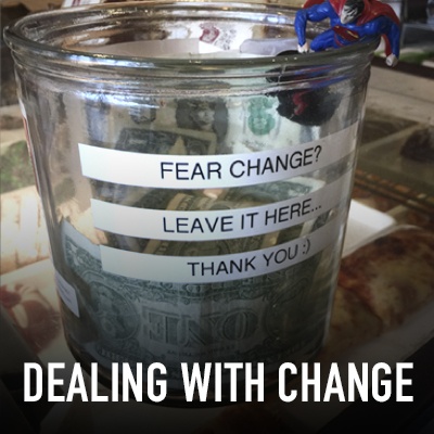 Glass tip jar with Dealing with Change title